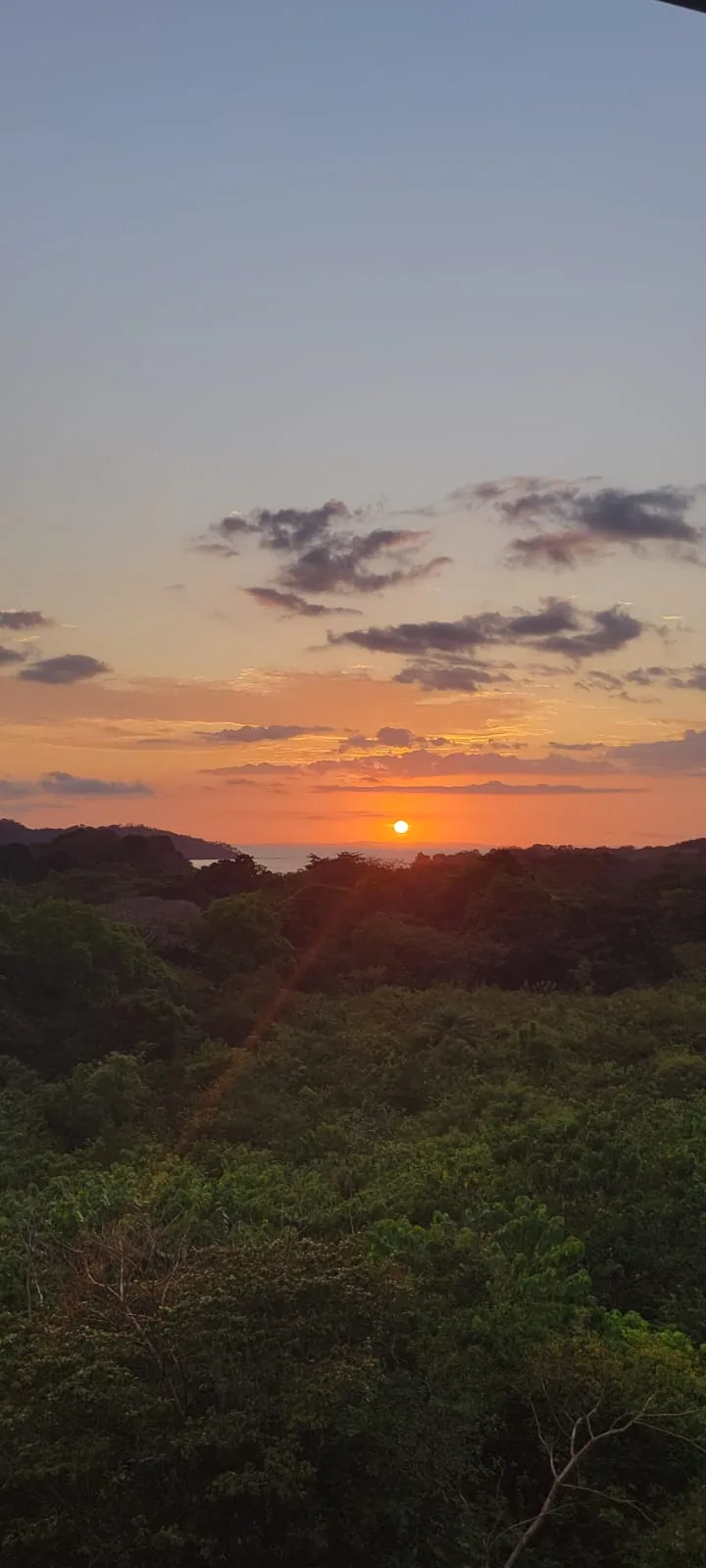 Sunset over the jungle and the Pacific near Santa Catalina